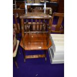 A late Victorian cane seated bedroom chair and a stained frame occasional table