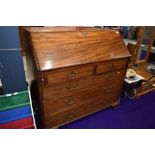 A 19th century mahogany bureau having fall flap with inlaid fitted interior over cockbeaded drawer