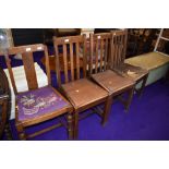 Four (three plus one) early to mid 20th Century oak dining chairs