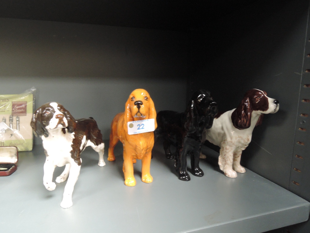 Four Beswick and Royal Doulton studies, Cocker Spaniels, black, golden brown and liver & white