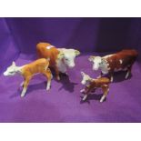 Four Beswick studies, Hereford Family, Bull 949, Cow (af) 899, Calf 854 and Calf 901B