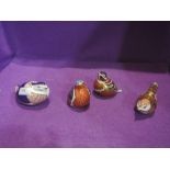 Four Royal Crown Derby paperweights, Robin, Derby Wren, Chaffinch and Quail all having gold stopper