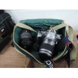 A Canon EOS 300v camera and Canon 75-300 lens in soft camera bag