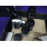 A Praktica PLC3 SLR camera with 50mm lens, a Panagar 49mm lens, a Zodel 28mm lens, a Sunagar 28-