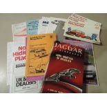 A selection of car dealership manuals brochures leaflets including Jaguar a Biography and Leyland