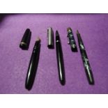 Three fountain pens including a Parker 51, a Parker Duofold and a De La Rue Onoto the pen