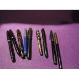 A selection of fountain pens including Sheaffer, Mentmore, Univeral, Platignum and Burnham