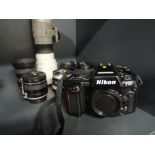 A Nikon F90 camera, Sigma 400mm Telephoto lens, Nikor 35-80 mm lens, Hoya 3x converter, Tamron 28-