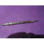 A 19th century mechanical sliding dipping pen at one end and sliding pencil at the other