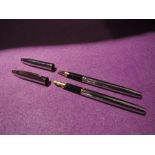 A Cross stainless steel with gold trim fountain pen and ballpoint pen set in leather case