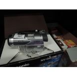 A Panasonic NV-GS70B digital video camera in original box and a box of Sony mini cassettes