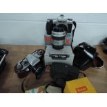 A Pentax MZ30 camera and Pentax 28-80 lens, a Praktica PL Nova 1B, a Kodak 44A camera and flash