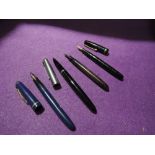 Four fountain pens, a Parker 51, an Osmiroid 65, a Watermans 503 and a Burnham (no Cap)