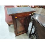 A 19th century mahogany wall cabinet having glass front and adjustable shelf interior