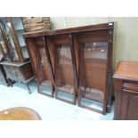 A late 19th century mahogany bookcase top having adjustable shelves with glass doors and classical