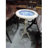 An early 20th century white painted pedestal wash stand having inset blue and white ceramic willow