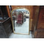 A 20th century gilt effect frame wall mirror of arch design