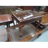 A modern mahogany effect coffee table having rectangular top on shell head cabriole legs