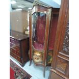 A mid/late 20th century French style vitrine having brass ormolu style applique and painted