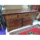 An early 19th century mahogany mule chest having lift lid with front dummy and four short drawers on