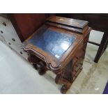 A Victorian walnut Davenport having stationery back with foliate inlay decoration with traditional