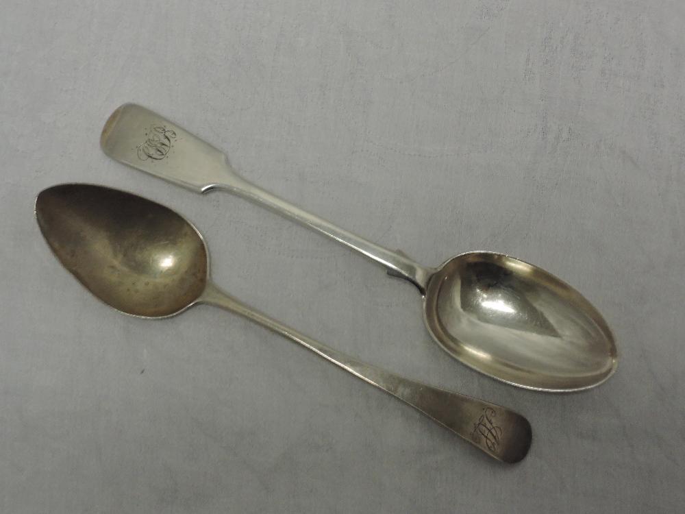 A Georgian silver table spoon of Old English form bearing monogram to terminal, London 1813,