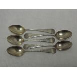 Five American silver dessert spoons having bright cut decoration and monogram to terminals, marked