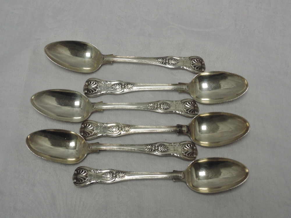 A set of six Georgian silver dessert spoons in the Kings pattern bearing small crest to terminals,
