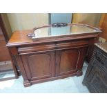 A mid Victorian mahogany chiffonier having crest arch mirror back with two pulvinated frieze