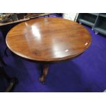 A Victorian mahogany centre /dining table having circular top on heavy bulbous column and triple