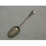 A George III silver table spoon of hanoverian form bearing monogram to reverse of terminal, London