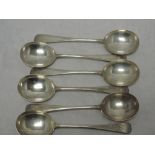 A set of six silver soup spoons of plain form monogrammed R to terminals, London 1923/24, Josiah