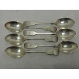 A set of six Edwardian silver dessert spoons of fiddle back form bearing monogram to terminals,