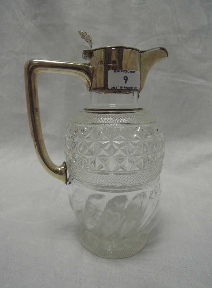 An Edwardian cut glass claret jug having silver handle and lid, Sheffield 1905, John Round (AF)