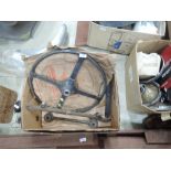 A box containing Jaguar steering wheel, wheel embellishers, silencer etc