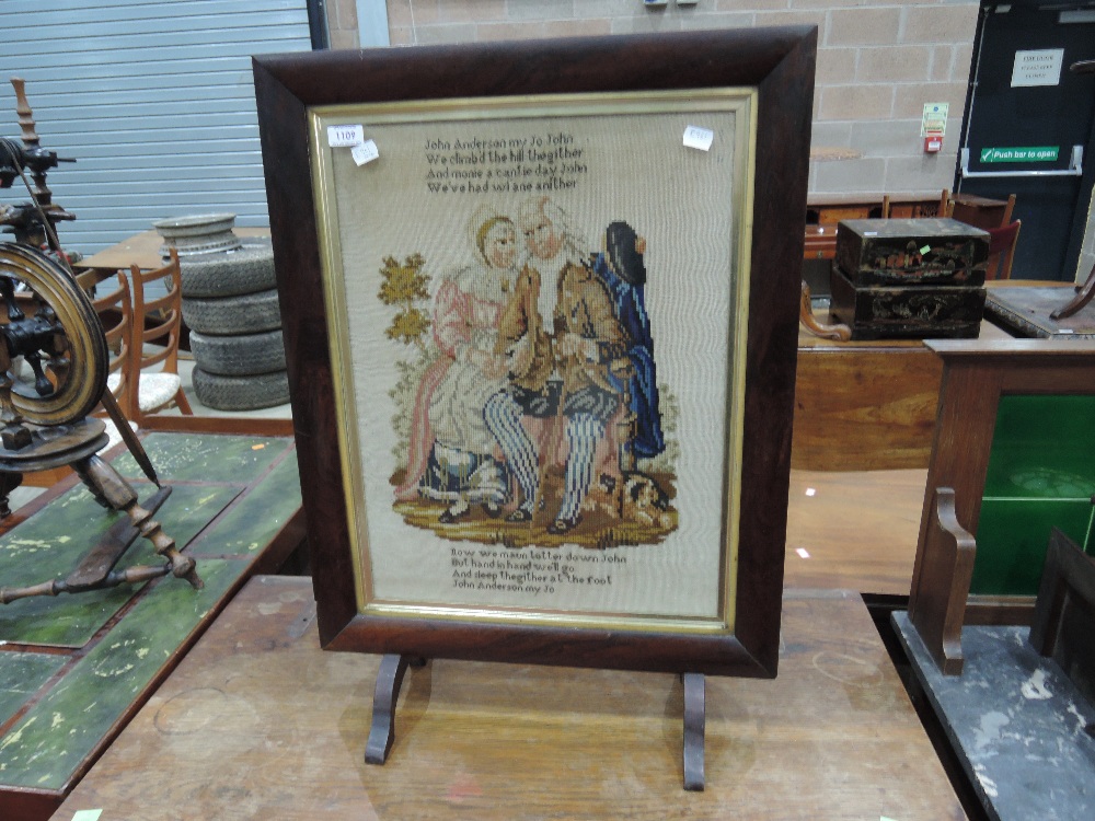 A mid Victorian Rosewood frame embroidered panel / fire screen with script and pictorial decorative,