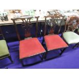 A pair of 19th century mahogany dining chairs in the Chippendale revival style having fret vase