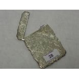 A Victorian silver card case of shaped form having extensive engraved decoration and monogrammed