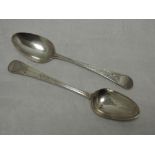 Two Georgian silver table spoons, both having bright cut decoration with plain cartouches, London