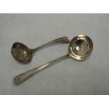 A Georgian silver ladle having moulded detail to stem, London 1786, George Smith III, and a white