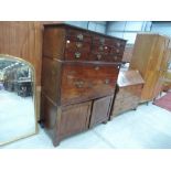 A 19th century mahogany full height secretaire chest having six small drawers over fall front fitted