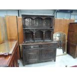 An 18th century and later oak composite tridarn cupboard having extensive lunette and medieval