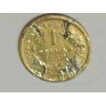 A USA 1852 gold Dollar having mount marks