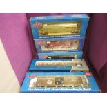 Four 0 gauge Atlas wagons, GATX Airslide Covered Hopper, USRA Box Car, NYC 3-Bay Central Hopper