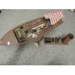 A radio controlled battery operated wood and plastic hand built model boat, named African Queen