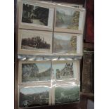 A modern postcard album containing approximately four hundred vintage postcards