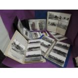 A collection of railway related postcards, mostly black and white and of steam interest, in five