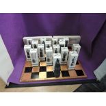 A Beneagles, The Thistle and the Rose chess set and board depicting English and Scottish