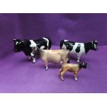 Four Beswick studies, Friesian Bull 1439A & Cow 1362A, Jersey Cow 1345 & Calf 1249D