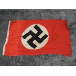 A German WW2 National and Mercantile Flag, size approx 31 x 19 inches, tear in bottom left corner